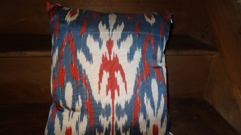 Feather filled ikat cushion
