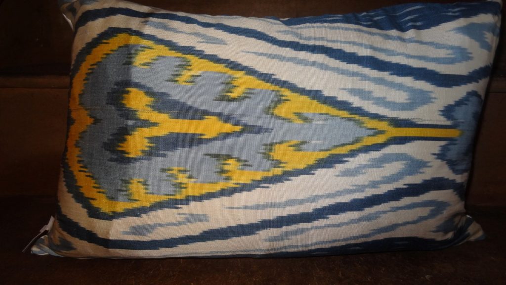 Blue and yellow traditional Ikat cushion