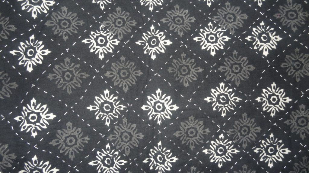 Black and white block printed quilted bedspread