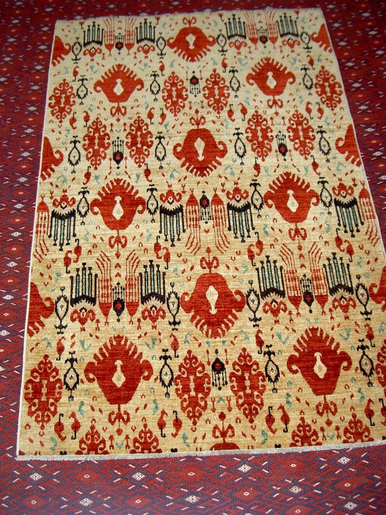 Contemporary vegetable dyed carpet from northern Afghanistan depicting Ikat design
